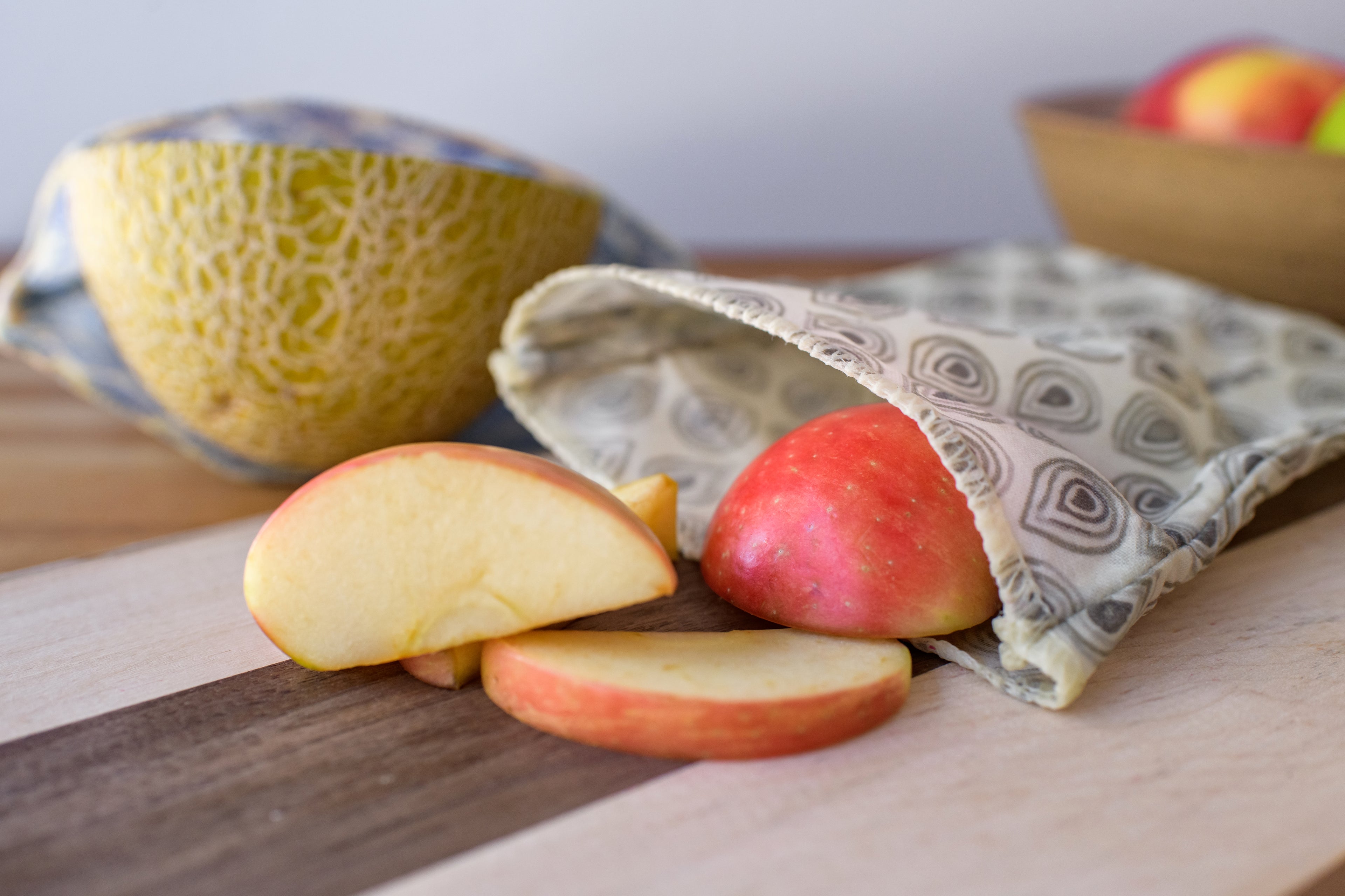 Reusable beeswax wraps for food storage of apples, cantaloupes and other fruits